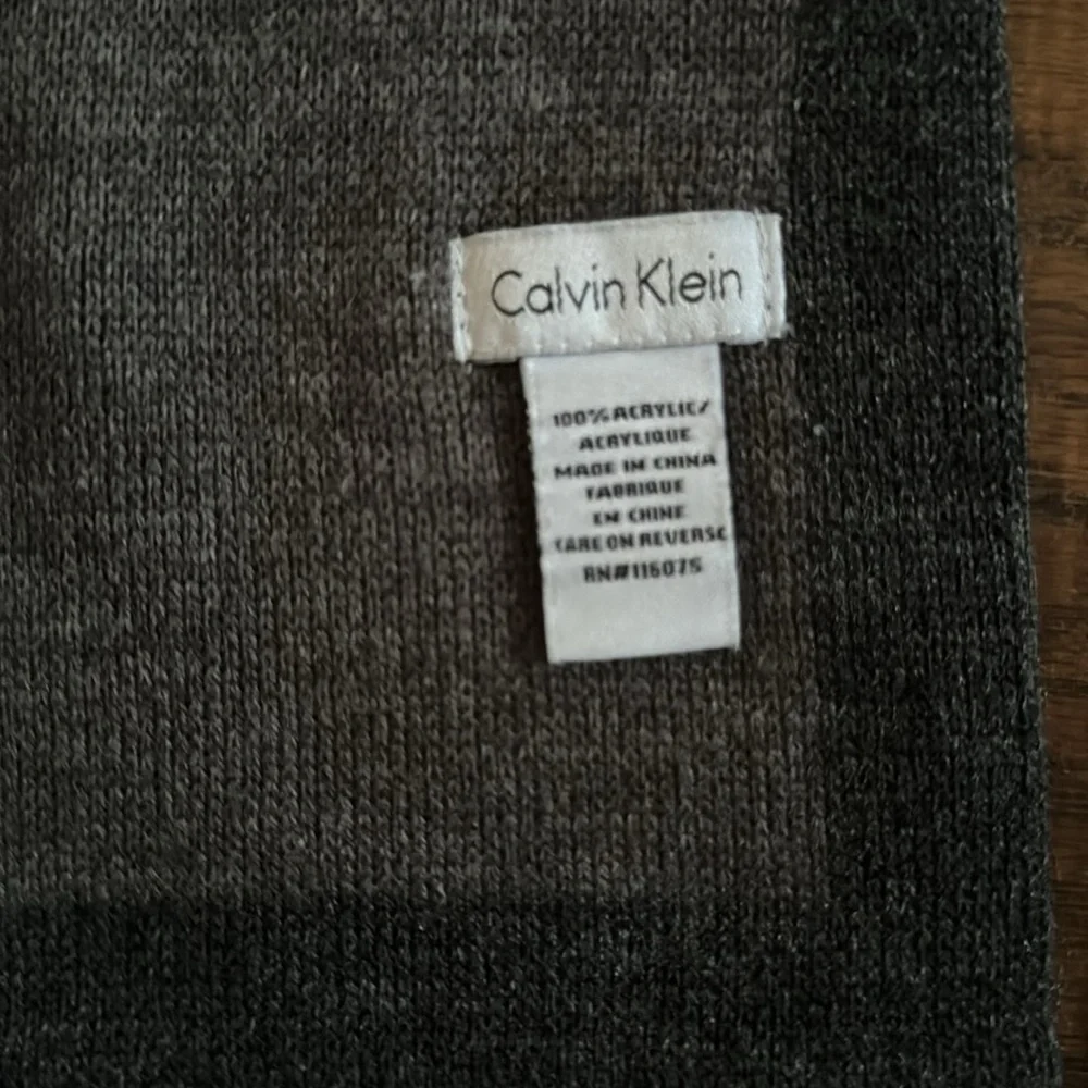 CALVIN KLEIN~CHARCOAL GRAY WITH DARK GRAY BORDER & LOGO AT BOTTOM OF SCARF~UEC